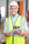 Male and female engineers smiling at work