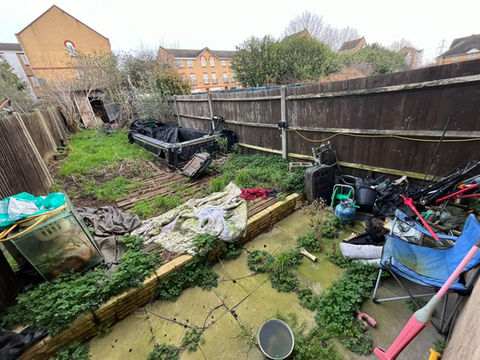 Back garden full of rubbish