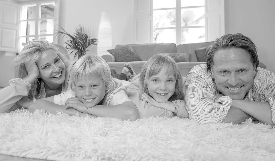 Happy family smiling at the camera