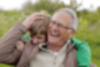 Grandfather and grandson laughing