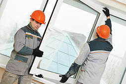 Workers installing UPVC windows