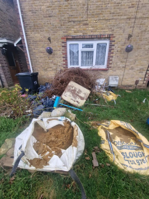 Garden lawn covered in rubbish