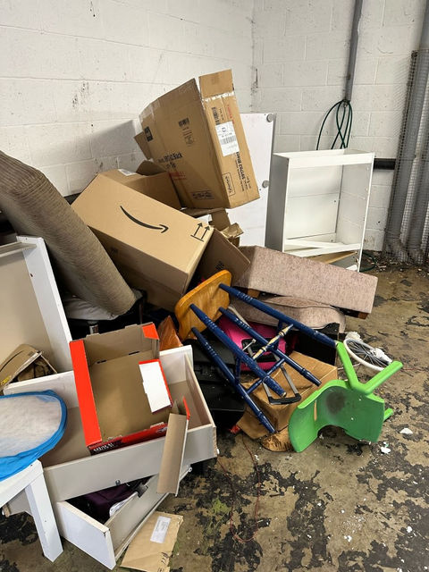 Yard full of old furniture and rubbish