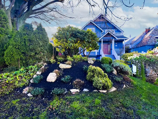 Garden in front of blue house