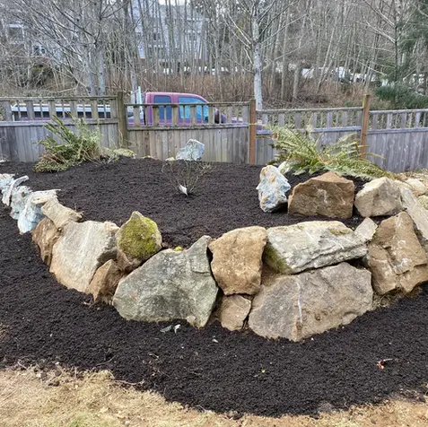Stone-edged garden bed