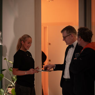 Event staff supporting guest reception at corporate event in Copenhagen, staffed by BRANDED by Focoso