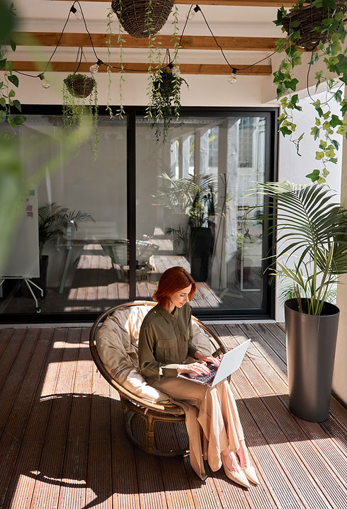 Busy young professional red-haired business woman entrepreneur holding laptop using comput