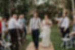 Bride and Groom recessional under of shower of Organic Wedding Confetti