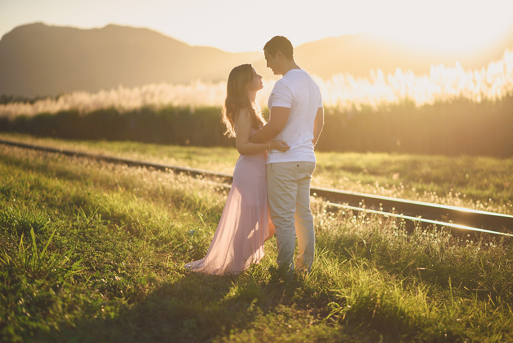 Couple looking tenderly at each each other during their Sunset Engagement Session in Cairns.