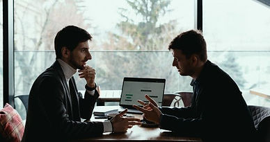 Two young businessman having a successful meeting at restaurant_ _ Free Photo.jpg