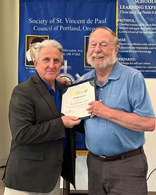 Men posing with certificate