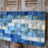 Thumbnail: Blue sky. An abstract 3D wood sculpture, a Wood Wall Art, made by small wooden and painted squares in various depths.