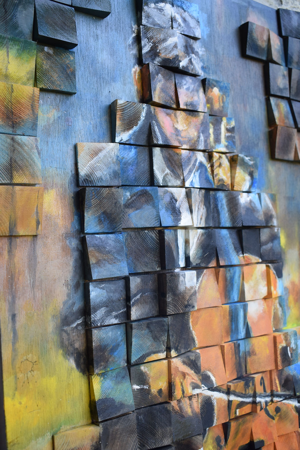 Thumbnail: Α painting made of small pieces of painted wood depicting a man playing the violin on the street.