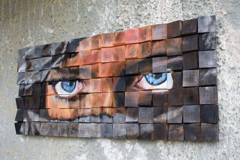 Thumbnail: The look of the eyes. A wooden painted mosaic hanging on the wall made by the Dreamodelers.