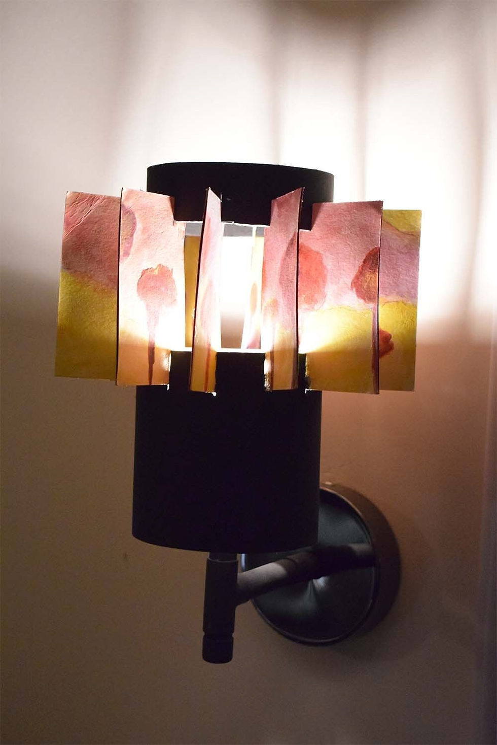 Thumbnail: Light for walls : Red Tree Sconce. It is a synthesis made by a plastic tube and recycled  paper painted with acrylics.