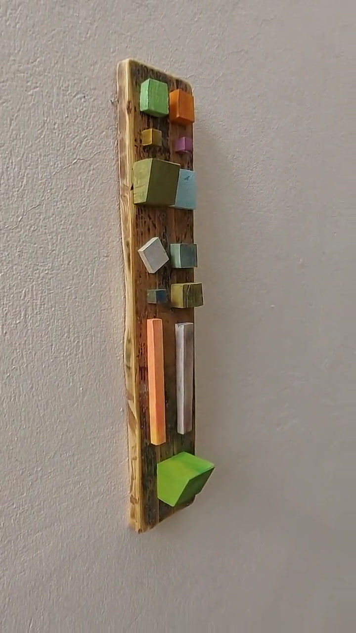 Thumbnail: Optical message 12, Boho wall decor. A boho wood sculpture, a handmade Wood Wall Art, made by small wooden painted squares.