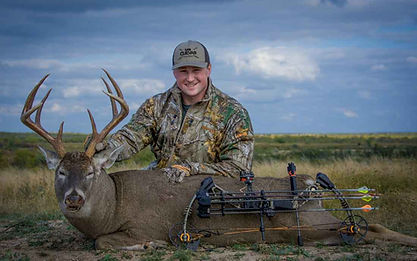 bow hunter with whitetail deer