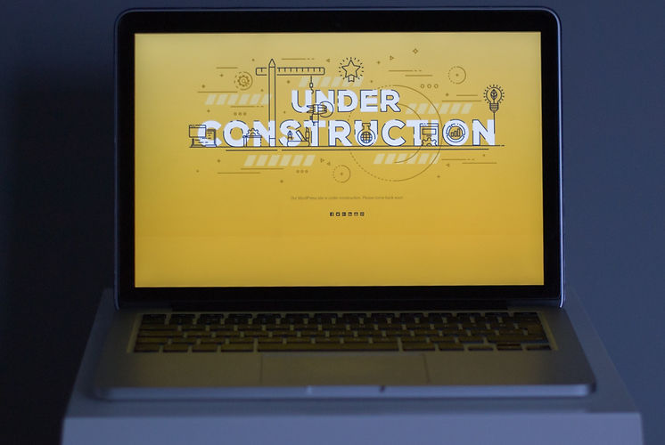A laptop showing an under-construction page created with a WordPress plugin_edited_edited.
