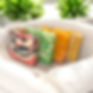 Four bars of handmade soap in a white basket