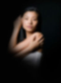 a woman striking a dramatic pose.