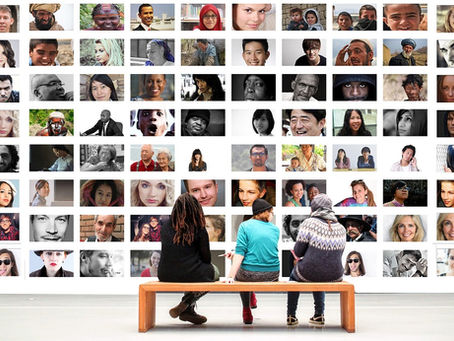 A wall showing images of diverse people