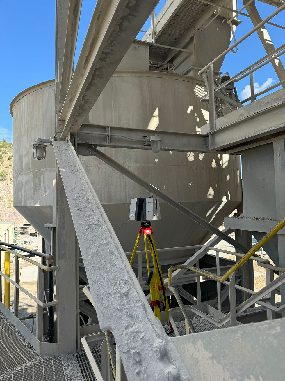 Eye-level view of a 3D laser scanner capturing detailed data inside an industrial facility