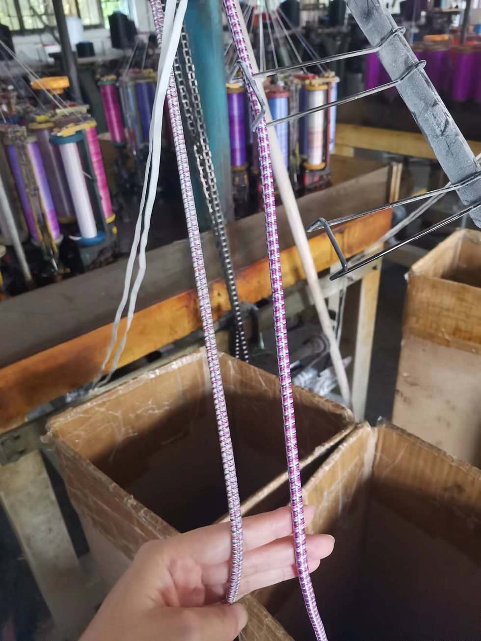 Eye-level view of a factory floor with machines producing hair accessories