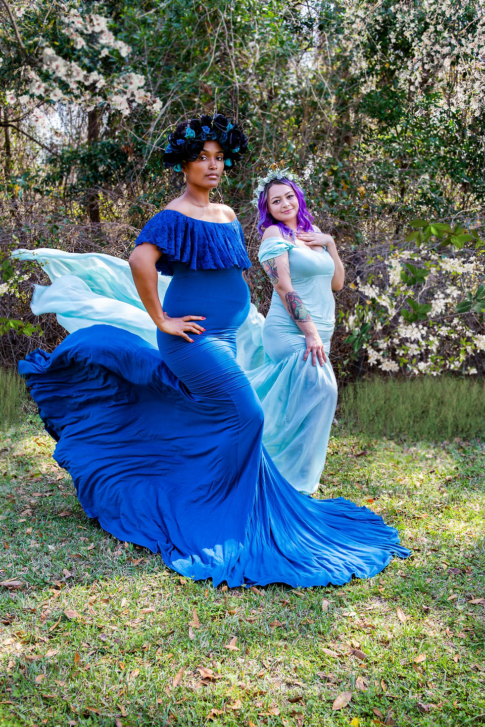 Two women in blue dresses for maternity photos