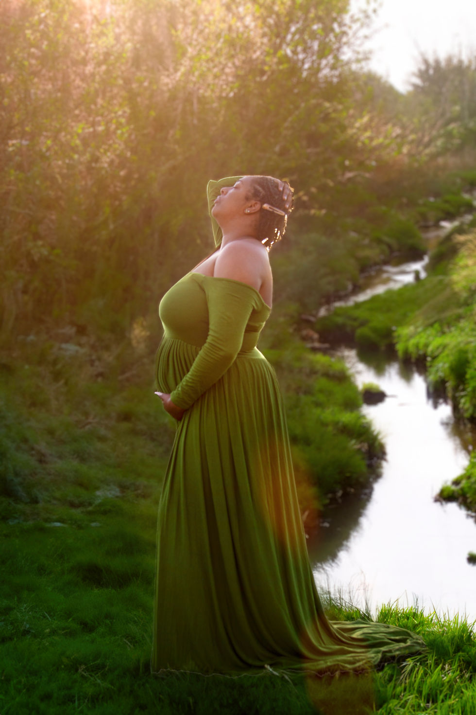 Pregnant woman in a green maternity gown