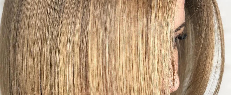 Sleek blonde bob haircut seen from the side