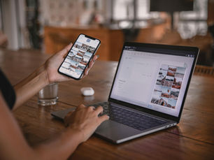 Woman Using Smartphone and Laptop