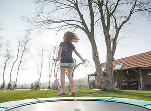 Girl Jumping on Trampoline