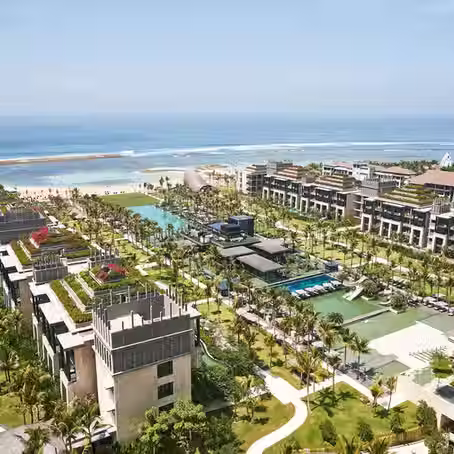 The Apurva Kempinski, a five-star beachfront resort in Nusa Dua, Bali, known for its grand architecture and luxury amenities.
