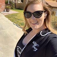 Photo of student, Katherine. Blonde lady in sun glasses.