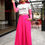 Thumbnail: woman wearing fanview t-shirt and long hot pink skirt