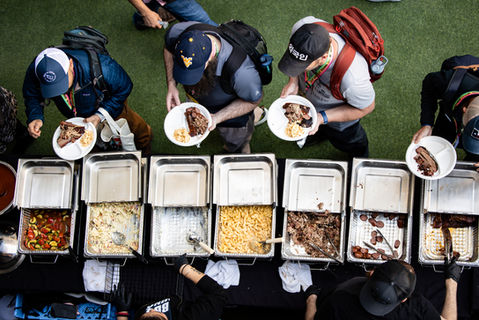 People line up for BBQ during a SXSW 2025 party