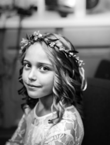 Portrait of a flower girl smiling at a wedding in Austin, Tx