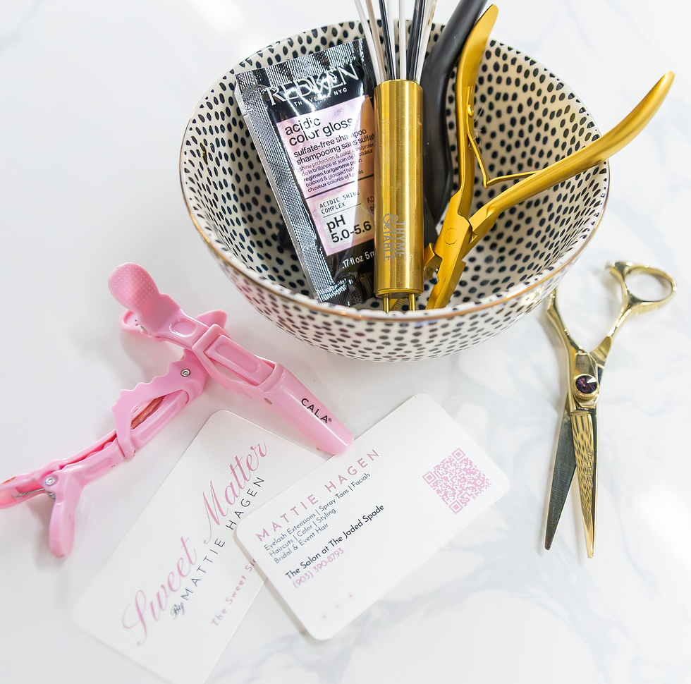 Hair coloring tools, whisk, scissors, and salon business cards.