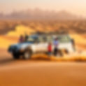family enjoying dubai desert on private land cruiser.jpg