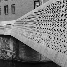 Black and white photograph of the 'Cast no Shadow' bridge across the canal at Ancoats.
Image by David Turner - Protected by Copyright Law - All Rights Reserved