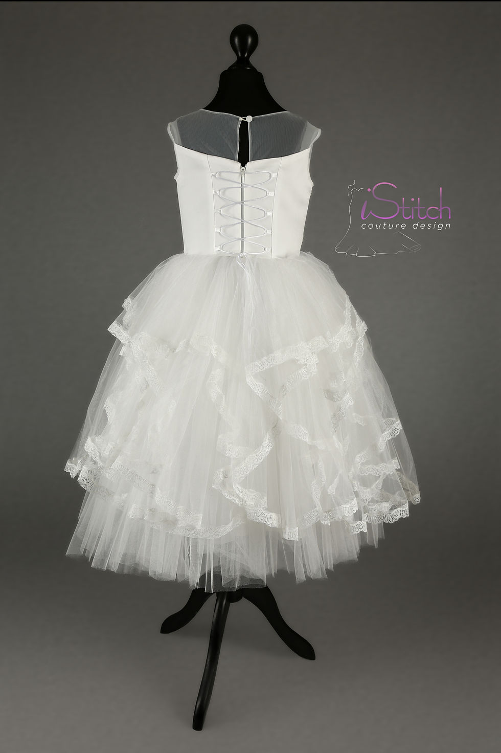 Thumbnail: Back of girls' communion dress with ribbon lace-up and sheer neckline