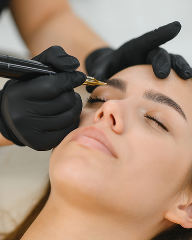 Woman receiving eyebrow microblading