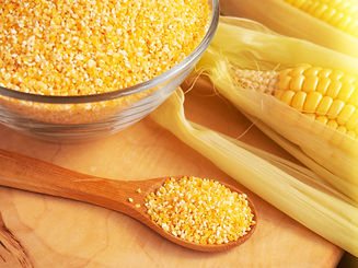 corn-grits-glass-bowl-wooden-spoon-close-up-old-wooden-table-copy-space.jpg