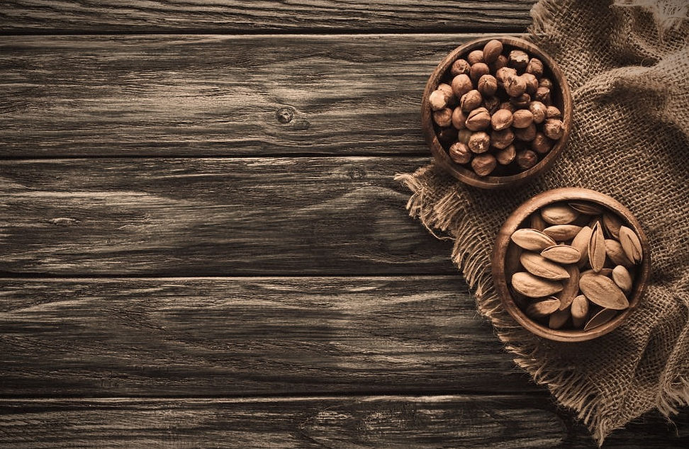 stock-photo-almonds-hazelnuts-wooden-bow
