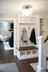 A mud room drop zone designed with custom closets.