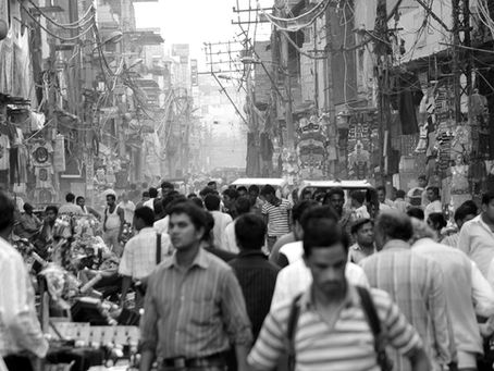 people walking in a busy town