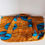 Miniature : Grand tote bag en wax africain avec des motifs d'oiseaux bleus sur des cercles turquoise, contrastant avec un fond à rayures
