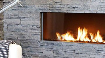 Fireplace and stone wall