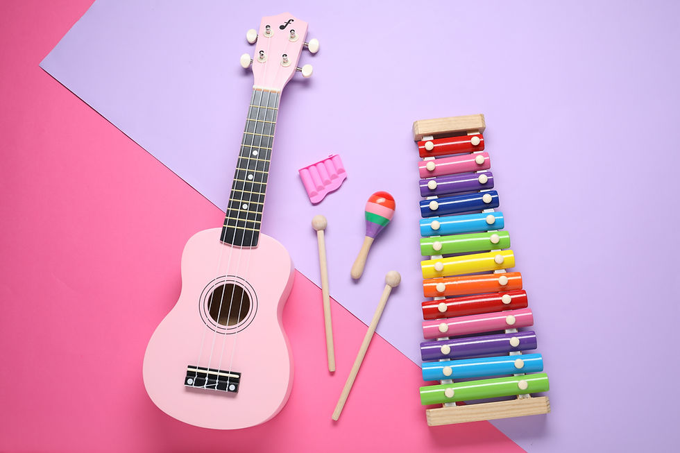 Flat lay composition with different toy musical instruments on color background.jpg