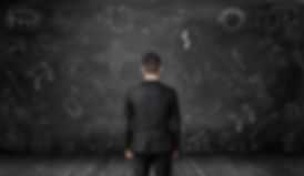 Back-view-of-businessman-looking-at-blac